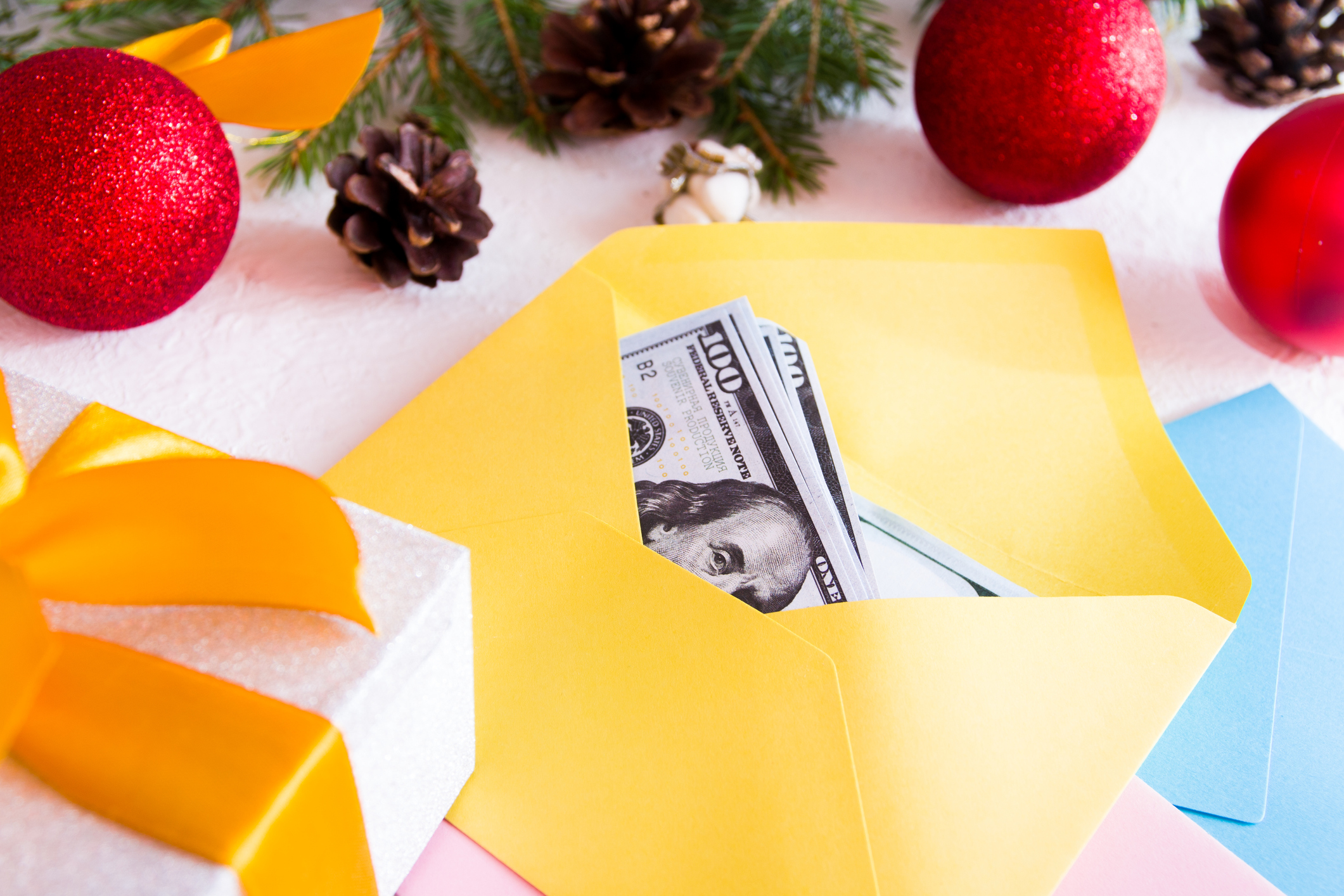 dollars in a yellow carpet on a background of Christmas decor, white background